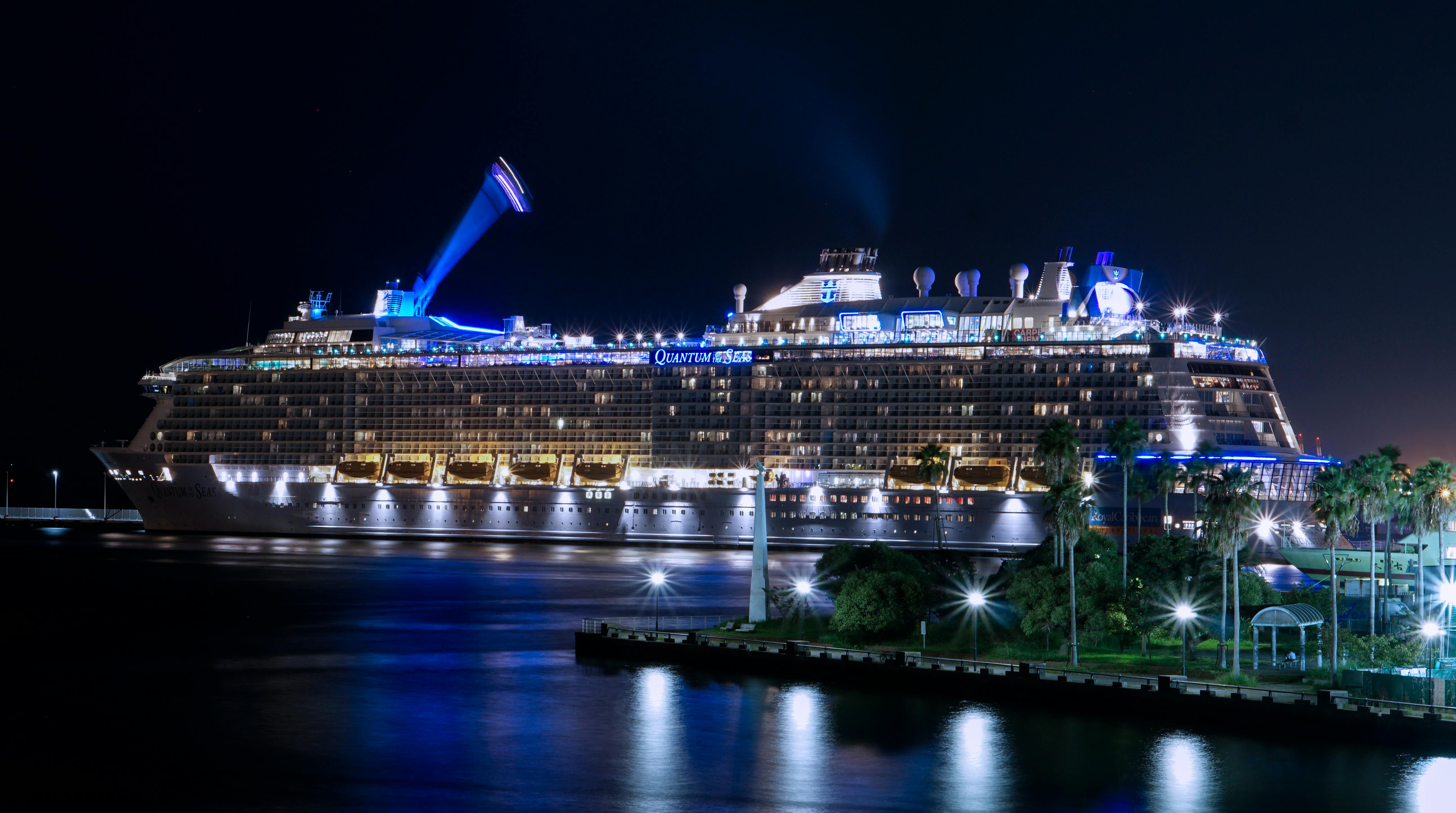 Royal Caribbean cruise ship at port by night